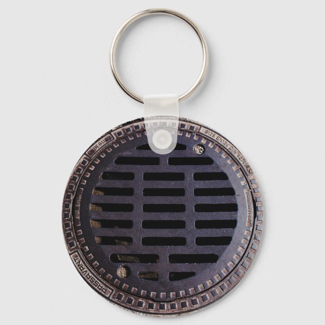 Manhole cover and cobblestone keychain (Front)