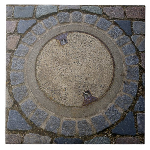 Manhole cover and cobblestone road ceramic tile