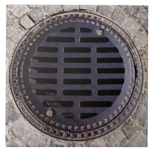 Manhole cover and cobblestone road ceramic tile