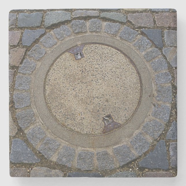 Manhole cover cobble stone road grey brown coaster (Front)