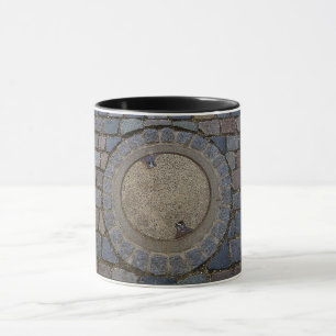 Manhole cover cobblestone road grey brown mug