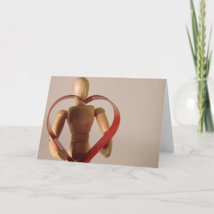 Mannequin holding heart holiday card