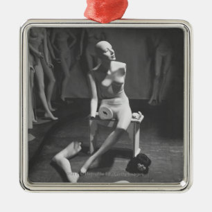 Mannequin with leg and arm removed metal ornament