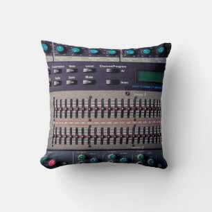 Many buttons on a sound mixer in a recording studi cushion