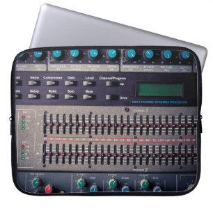 Many buttons on a sound mixer in a recording studi laptop sleeve