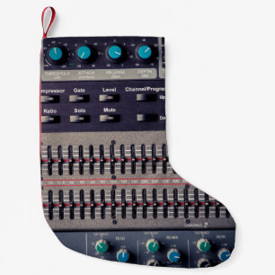 Many buttons on a sound mixer in a recording studi small christmas stocking