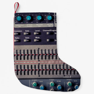 Many buttons on a sound mixer in a recording studi small christmas stocking