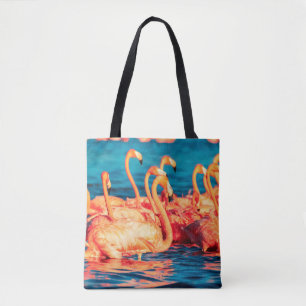 Many pink coral beautiful wild flamingos in blue l tote bag