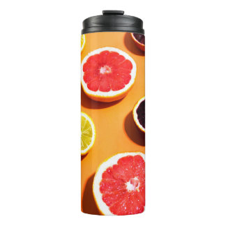 Many variety citrus fruits pattern in sunlight on  thermal tumbler