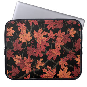 Maple leaves on white laptop sleeve