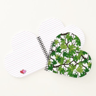 Maple leaves on black notebook