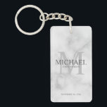 Marble Personalised Groomsmen's name and monogram Key Ring<br><div class="desc">Add a personal touch to your wedding with personalised groomsmen keychain. This keychain features personalised groomsman's name with title and wedding date in grey and monogram in light grey as background, in classic serif font style, on white marble background. Also perfect for best man, father of the bride, ring bearer...</div>