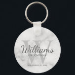 Marble Personalised Script Groomsmen Key Ring<br><div class="desc">Add a personal touch to your wedding with personalised groomsmen keychain. This keychain features personalised groomsman's name in grey classic script font style with wedding details in grey classic serif font style and monogram in light grey classic serif font style as background, on white marble background. Also perfect for best...</div>