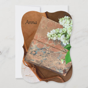 Marbled and leather-bound books with lilacs invitation