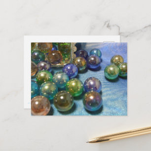 Marbles spilling from a jewelry box postcard