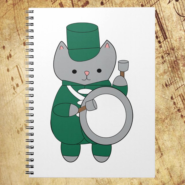 Marching Band Cat Bass Drum Green and White Notebook (A cute notebook with a cat wearing a green and white marching band uniform with a drum)