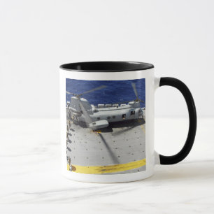 Marines board a CH-46E Sea Knight helicopter Mug