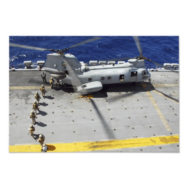 Marines board a CH-46E Sea Knight helicopter Photo Print (Front)