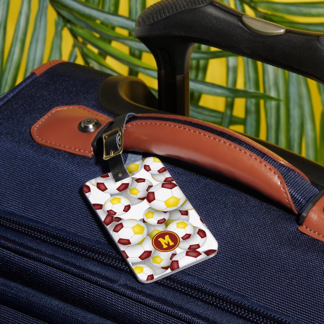 maroon gold soccer balls pattern luggage tag (Front Insitu 1)