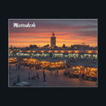 Marrakesh Morocco Travel Postcard<br><div class="desc">Marrakesh, often called the "Red City" because of its distinctive red sandstone buildings, is one of Morocco’s most vibrant and historic cities. Located at the foothills of the Atlas Mountains, it has been a major cultural and trading hub for centuries. At the heart of Marrakesh is the bustling Jemaa el-Fnaa,...</div>