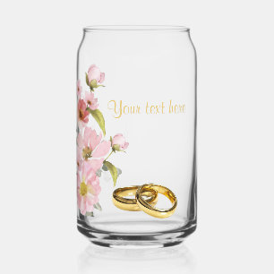 marriage rings and pink flowers can glass