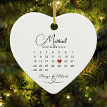 Married Calendar Wedding Date Keepsake White Ceramic Ornament<br><div class="desc">Celebrate love with our Heart-Shaped Married Ornament, the perfect Wedding Gift for newlyweds! This Ceramic Wedding Date Ornament features an elegant script on a clean white background, with a vibrant red heart marking your special wedding day on the calendar. Whether it's a thoughtful Calendar Anniversary Gift or a cherished keepsake,...</div>