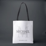 Masculine Personalised Groomsmen Tote Bag<br><div class="desc">Add a personal touch to your wedding with personalised groomsmen tote bag. This bag features personalised groomsman's name with title and wedding date in grey and monogram in light grey as background, in classic serif font style, on white background. Also perfect for best man, father of the bride, ring bearer...</div>