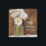 Mason Jar and White Daisies Country Barn Wedding Stone Magnet<br><div class="desc">Customise these charming Mason Jar and White Daisies Country Barn Wedding Stone Magnets with the personal names of the bride and groom and specific marriage ceremony date. These rustic chic custom ranch style wedding magnets feature a quaint floral photograph of a glass canning jar filled with a bouquet of white...</div>