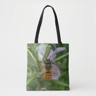 Massive bee, or maybee(!) other insect, on a bag. tote bag