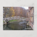 Mathematical bridge postcard<br><div class="desc">The Mathematical Bridge is the popular name of a wooden footbridge across the River Cam,  between two parts of Queens' College,  Cambridge. Its official name is simply the Wooden Bridge. The bridge was designed by William Etheridge,  and built by James Essex in 1749.</div>