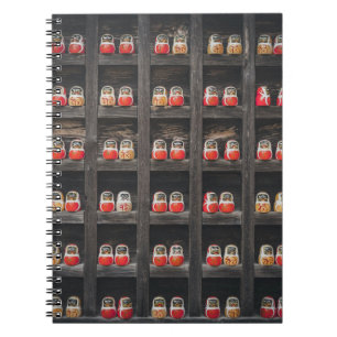 Matryoshka doll lot on shelf notebook