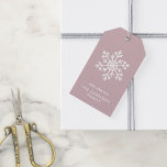 Mauve Winter Snowflake Holiday Gift Tags<br><div class="desc">Custom printed holiday gift tags with a simple white snowflake on a blush pink background. Use the design tools to edit the text,  change the fonts and colours or upload your own photo to design your own unique personalised Christmas gift tags.</div>