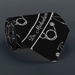 Medical Doctor Stethoscope Pattern Physician Name Tie<br><div class="desc">This design is great for doctors, nurses, physicians, and any many other medical practitioners. The stethoscope patterns sits on top of a black background, and at the bottom of the tie is a space to add the name of the person wearing the tie.</div>