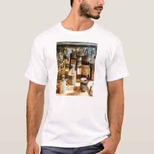 Medicine Bottles in Glass Case T-Shirt