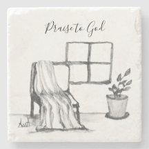Meditation chair by window with plant and throw