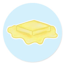 Melting Butter Pat on Blue