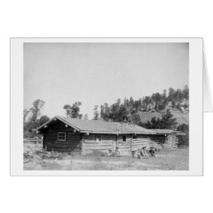 Men Sitting outside Log Cabin in South Dakota