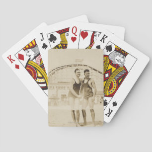 Men Standing on Beach Playing Cards