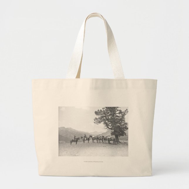 Men with packhorses looking over a hill large tote bag (Front)