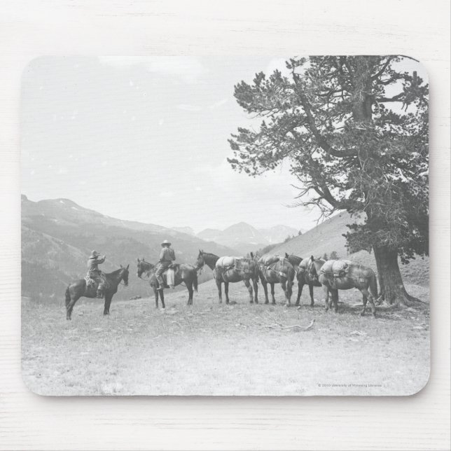 Men with packhorses looking over a hill mouse pad (Front)
