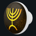 Menorah Flame Ceramic Knob<br><div class="desc">A brown and gold digital rendering of the Jewish seven-branched menorah (Hebrew: מְנוֹרָה). The seven-branched menorah, used in the portable sanctuary set up by Moses in the wilderness and later in the Temple in Jerusalem, has been a symbol of Judaism since ancient times and is the emblem on the coat...</div>