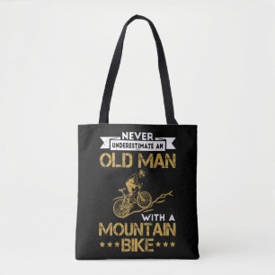 Mens Never Underestimate An Old Man With A Mountai Tote Bag