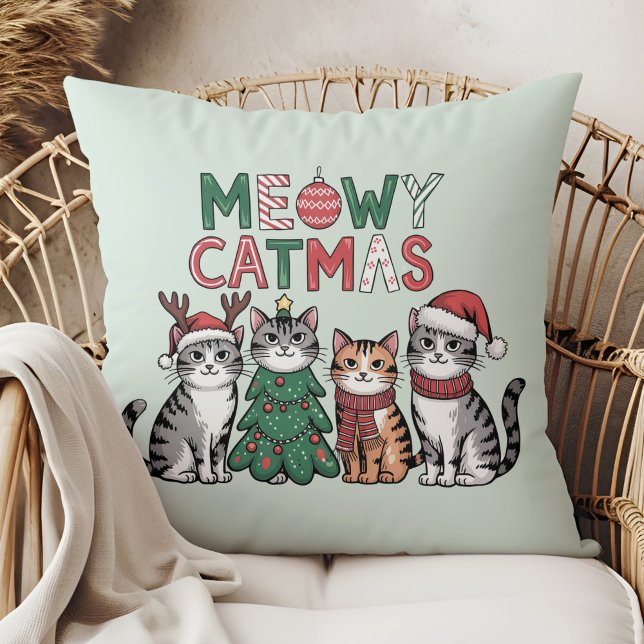 Meowy Catmas Cute Christmas Cats - Holiday Decor Cushion (Meowy Catmas Cute Christmas Cats - Holiday Decor Throw Pillow in a boho rattan armchair.)