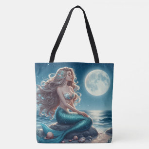 Mermaid on the beach at night tote bag