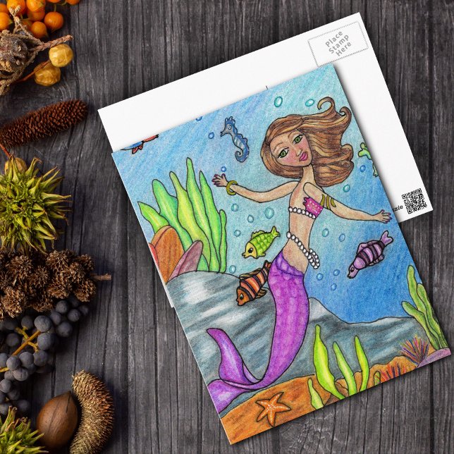 Mermaid Swimming With Fish Postcard (Pretty pink mermaid by rocks with fish in ocean on postcard.)