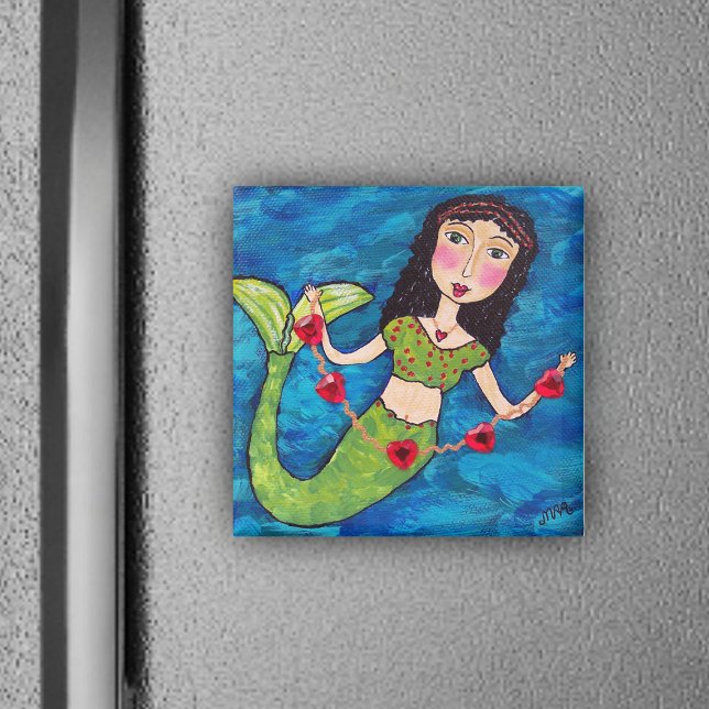Mermaid With Hearts Magnet (Mermaid green tail holding gold string of red heats on ocean blue magnet.)