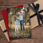 Merriest Christmas Elegant Script Photo Christmas Holiday Card<br><div class="desc">This simple full photo Christmas card features a blend of elegant serif and script text. The white text appears on top of the photo. Personalise with your name.</div>