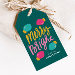 Merry and Bright Christmas Lights Holiday Gift Tags<br><div class="desc">Cute and colorful holiday gift tags featuring the phrase "Merry Bright" on the front in gold, turquoise, pink hand-lettering against a teal background. Cute Christmas light bulbs surround the text in hot pink and turquoise with gold-colored bases. Personalize the front of the modern holiday gift tags by adding your name...</div>