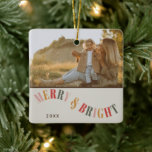 Merry and Bright Custom Family Photo Christmas Ceramic Ornament<br><div class="desc">Celebrate the festive season with our Merry and Bright Custom Family Photo Christmas Ceramic Ornament. This ornament captures the warmth and joy of Christmas with a simple yet modern design that features warm, contemporary colours. Perfect for adding a personalised touch to your holiday decor, it allows you to showcase a...</div>
