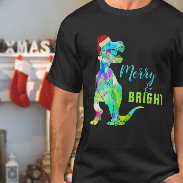 Merry and Bright Funny Christmas Dinosaur T-Shirt (Merry and bright funny Christmas dinosaur T-shirt Colorful T-Rex wearing a santa hat )